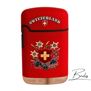 Un briquet souvenir suisse élégant en rouge vif, décoré de la croix dorée et de fleurs alpines. Accessoire pratique et authentique, parfait comme cadeau de Suisse.